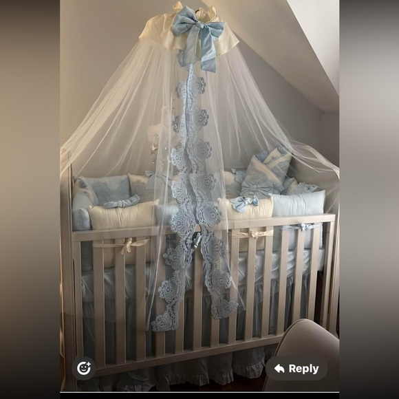 Charming White and Blue Crib with Lace Canopy